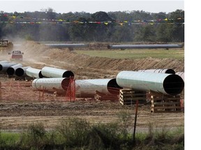 File - In this Oct. 4, 2012 file photo, large sections of pipe are shown in Sumner Texas. Safety regulators have quietly placed two extra conditions on construction of TransCanada Corp.?s Keystone XL oil pipeline after learning of potentially dangerous construction defects involving the pipeline?s southern leg.  The new conditions were added four months after the pipeline safety agency sent TransCanada two warning letters about defects and other construction problems on the Keystone Gulf Coast Pipeline, which extends from Oklahoma to the Texas Gulf Coast. (AP Photo/Tony Gutierrez, file)