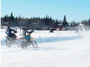 Numb Bum Ice Race riders go through the first turn at Saturday’s event west of Morinville. A 51-year-old motorcycle driver from Lacombe died after suffering serious injuries during a crash on the 18-km course.