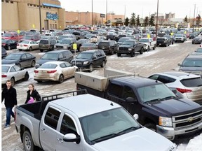 People hunt for a parking spot at West Edmonton Mall in Edmonton.