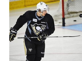 Pittsburgh Penguins centre Sidney Crosby keeps a puck of the Pittsburgh Penguins shows off his hand-eye co-ordination but using the blade of his stick to keep a puck airborne during Tuesday’s practice at Rexall Place.