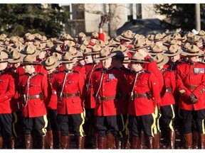 RCMP officers wait to take part in the procession for the  regimental funeral of Const. David Wynn, 42, on January 26, 2015 in St. Albert .  Const. Wynn, died in hospital Wednesday, Jan. 21, four days after he was shot in the head while responding to a call at a casino in St. Albert.
