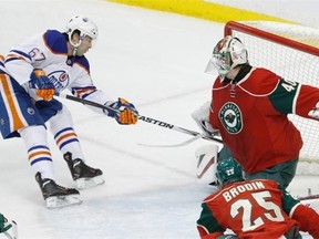 Benoit Pouliot beats Devan Dubnyk for the game's opening goal.