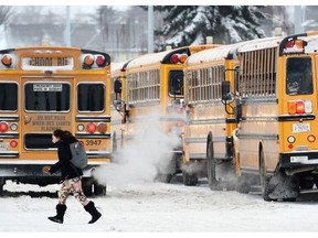 School buses lined up outside Victoria School in Edmonton on Friday.