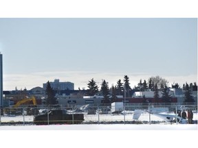 A small airplane made an emergency landing at the closed Edmonton City Centre Airport on Feb. 21, 2015. The pilot deployed a parachute from the plane and descended to the ground after experiencing engine trouble. The wind flipped the plane over after it landed. The airport and its runways were closed in 2013.