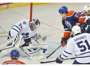 Toronto Maple Leafs goalie James Reimer makes a save on Edmonton Oilers’ Boyd Gordon in the third period of a game at Rexall Place in Edmonton on Oct. 29, 2013.