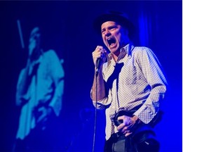 The Tragically Hip’s lead singer Gordon Downie celebrates his birthday on stage at Vancouver’s Rogers Arena on Friday.