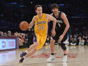 FILE - MARCH 21: Los Angeles Lakers point guard and two-time MVP Steve Nash announced his retirement from the NBA on March 21, 2015. Nash, 41, played 18 seasons for the Phoenix Suns, Dallas Mavericks and Los Angeles Lakers. He finishes his career with 10,335 assists, third-most in NBA history. LOS ANGELES, CA - FEBRUARY 28:  Steve Nash #10 of the Los Angeles Lakers drives the basket on Ricky Rubio #9 of the Minnesota Timberwolves at Staples Center on February 28, 2013 in Los Angeles, California.  NOTE TO USER: User expressly acknowledges and agrees that, by downloading and or using this photograph, User is consenting to the terms and conditions of the Getty Images License Agreement.  (Photo by Harry How/Getty Images)