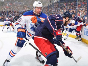 Edmonton Oilers demonstrate solid d-zone coverage some of the time, like here where Martin Marincin (foreground), Matt Hendricks and Mark Fayne each shadow their man.