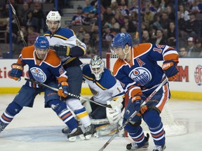 EDMONTON, AB. FEBRUARY 28, 2015 - Jordan Eberle (14) of the Edmonton Oilers, tries to make a play in front of goalie Brian Elliott (1) of the St. Louis Blues  at Rexall Place in Edmonton. Shaughn Butts/Edmonton Journal