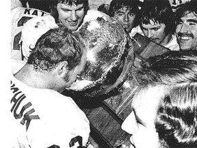 The 1972 Golden Bears football team soaks in its second-ever Vanier Cup national title win. Alberta defeated the Waterloo Lutheran Golden Hawks 20-7 on Nov. 25, 1972. Championship wins have been scarce for the team, which is battling back from a very long slump.