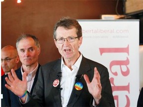 Alberta interim Liberal party leader David Swann stands with fellow Liberal candidates as he talks to reporters at the Liberal party campaign kickoff in downtown Calgary on Tuesday, April 7, 2015.