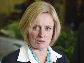 Alberta NDP Leader Rachel Notley speaks to reporters Friday about Premier Jim Prentice’s “look in the mirror” comments on CBC Radio.