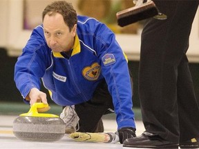 Alberta skip Glen Hansen delivers his rock in a Canadian senior men’s curling championship game at the Thistle Curling Club on March 21, 2015.