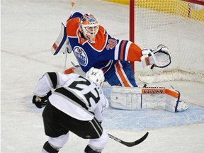 Los Angeles Kings center Trevor Lewis scores on Edmonton Oilers goalie Ben Scrivens during first period NHL action in Edmonton on March 3, 2015.