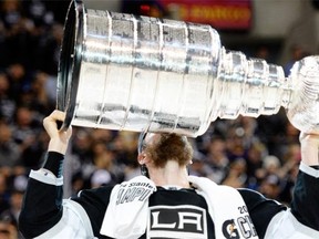 Los Angeles Kings forward Jeff Carter kisses the Stanley Cup in celebration after defeating the New York Rangers 3-2 in double overtime of Game 5 of the 2014 Stanley Cup Final at Staples Center on June 13, 2014 in Los Angeles.