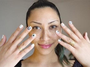 Annaliza Toledo shows off some of the possible choices from her nail art business, Nailcart.