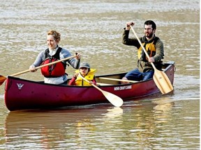Benoit Gendreau-Berthiaume (right), Magali Moffatt (left)  and their son Mali Berthiaume are canoeing and portaging from Edmonton to Montreal. The trip will take approximately four months.