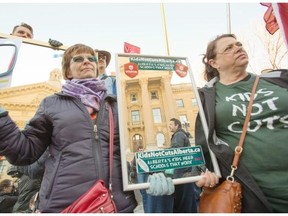 Gil Mc­Gow­an, Al­berta Federation of Labour pres­ident speaks to a crowd of dem­on­stra­tors at the steps of the Al­berta Legislature in Ed­mon­ton on March 7, 2015. Fol­low­ing Al­berta Premier Jim Prentice’s com­ments this week that Al­ber­tans need to take a hard look in the mir­ror over the prov­ince’s fi­nan­cial prob­lems, a dem­on­stra­tion was held on the steps of the Legislature to hold up mir­rors to the build­ing and PC gov­ern­ment.