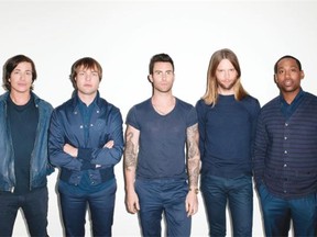 Blue denim-clad publicity photo of Maroon 5, led by Adam Levine (centre)