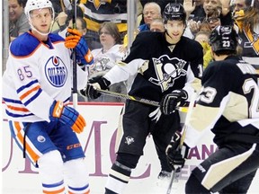 Brandon Sutter #16 of the Pittsburgh Penguins reacts after scoring his second goal of the game in the first period against Martin Marincin #85 of the Edmonton Oilers during the game at Consol Energy Center on March 12, 2015 in Pittsburgh.
