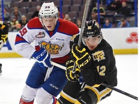 Brett Pollock of the Edmonton Oil Kings chases Reid Gow of the Brandon Wheat Kings in a Western Hockey League game at Rexall Place on Jan. 13, 2014.