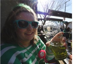 Brittany Wiebe was celebrationg her 26th birthday as well as St. Patrick’s Day, with some green beer at O’Byrne’s Irish Pub on Whyte Av. in Edmonton on Tuesday Mar. 17, 2015.