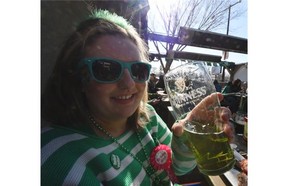 Brittany Wiebe was celebrationg her 26th birthday as well as St. Patrick’s Day, with some green beer at O’Byrne’s Irish Pub on Whyte Av. in Edmonton on Tuesday Mar. 17, 2015.