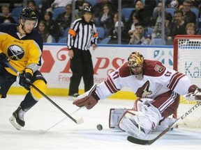 Buffalo Sabres forward Mikhail Grigorenko (25), of Russia, backhands a shot against Arizona Coyotes goalie Mike Smith during NHL action on March 26, 2015, in Buffalo, N.Y.