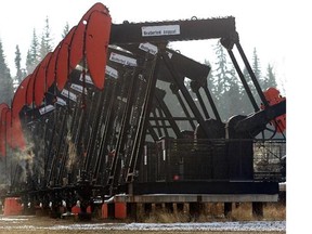 Pump jacks in operation at Imperial Oil Resources oil production pad near Cold Lake, Alberta.