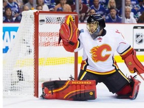 Calgary Flames’ goalie Jonas Hiller stops a shot during an NHL playoff game Friday in Vancouver: one loyal Oilers fan's mantra during the playoffs is ‘anyone but Cowtown.’