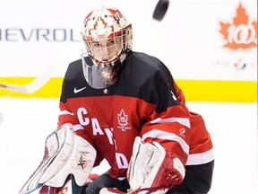 Canada goalie Zach Fucale makes a save against Russia during third period exhibition hockey action in preparation for the upcoming IIHF World Junior Championships in Toronto on Dec. 19, 2014.