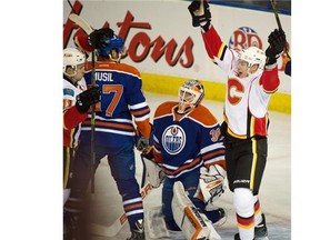 Joe Colborne (8) of the Calgary Flames celebrates a goal against Edmonton Oilers goalie Ben Scrivens during NHL action at Rexall Place in Edmonton April 4, 2015. The visiting Flames shut out the Oilers 4-0.