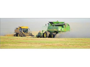 A combine harvests barley near Camrose. The Agriculture Financial Services Corp. - a lending and insurance agency for rural businesses and producers - is closing nine of its 55 offices.