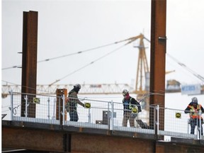 Construction workers continue work on the new arena project downtown in this November 2014 photograph. The arena is expected to be open in 2016.