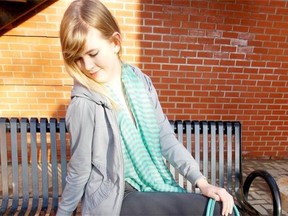 Courtney Nickerson wears a jacket with diva collar $159.95, striped bamboo tank $35.95, grey bamboo leggings $44.95, striped infinity scarf, $24.95; vegan turquoise bag $79.99; all from The Pear Tree.