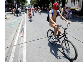 Cyclists take part in the World Naked Bike Ride to protest against cars, gas emissions from cars and agressive drivers, in Mexico City on June 14, 2014.