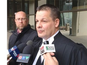 Defence lawyer Daryl Royer speaks about his client, Baby M’s mother, outside court in Edmonton on Friday, March 6, 2015.