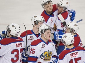 The dejected Edmonton Oil Kings hug after losing 3-2 in double-overtime to the Brandon Wheat Kings on Wednesday at Rexall Place.