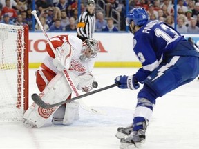 Detroit Red Wings goalie Petr Mrazek makes a glove save on a shot by Tampa Bay Lightning centre Cedric Paquette during Game 1 of their first-round NHL playoff series on April 16, 2015, in Tampa, Fla.