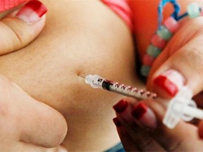 A diabetic performs an insulin injection.
