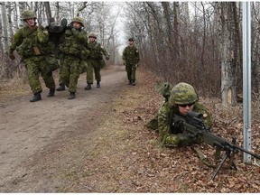 Troops from 1 Canadian Mechanized Brigade Group (1 CMBG) arrive by helicopter to compete in Exercise Herakles Ram in Hawrelak Park in Edmonton on Tuesday April 14, 2015. The exercise will run over three days in the park and at Edmonton Garrison.