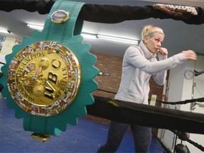 Edmonton boxer Jelena Mrdjenovich successfully defended her world champion title last week in Panama. She poses for a photo at Avenue Boxing Club in Edmonton on April 2, 2015.