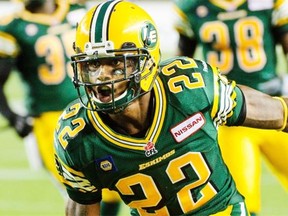 Edmonton Eskimos cornerback Joe Burnett celebrates after intercepting a pass by the Hamilton Tiger-Cats during a CFL game at Commonwealth Stadium on July 4, 2014, in Edmonton.