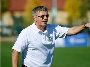 FC Edmonton head coach Colin Miller yells out instructions to his players during a North American Soccer League game against the Tampa Bay Rowdies at Clarke Field on Sept. 21, 2014.