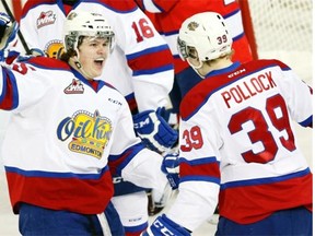 Edmonton Oil Kings centre Lane Bauer (left) celebrates his third goal of the game with teammate Brett Pollock during WHL action against the Regina Pats in Edmonton on Jan. 16, 2015.