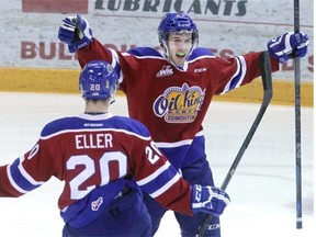 Edmonton Oil Kings forward Tyler Robertson celebrates a goal on the Brandon Wheat Kings with teammate Mads Eller 11 seconds into Game 1 of their Western Hockey League Eastern Conference quarter-final series on Thursday, March 26, 2015, at Westman Place in Brandon, Man. The Oil Kings won the game 4-1.