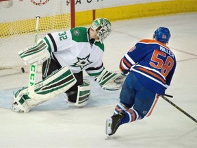 Edmonton Oilers Andrew Miller (58) scores his first NHL goal on a penalty shot on Dallas Stars goalie Kari Lehtonen (32) during NHL action at Rexall Place in Edmonton, March 28, 2015.