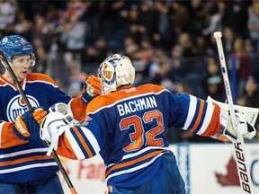 Edmonton Oilers defenceman Keith Aulie and goaltender Richard Bachman celebrate Tuesday’s 4-2 win over the Los Angeles Kings in an NHL game at Rexall Place.