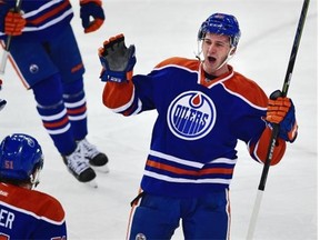 Edmonton Oilers defenceman Martin Marincin celebrates after scoring his first NHL goal against the Colorado Avalanche during an NHL game at Rexall Place on March 26, 2015.