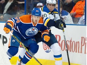 Edmonton Oilers defenceman Oscar Klefbom, left, checks Alexander Steen of the St. Louis Blues at Rexall Place in February NHL action.